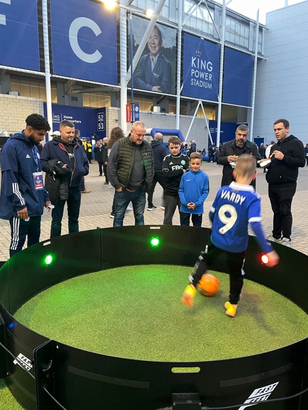 Home 3 Young boy plays at corporate event with exergame ICON Fast Feet football fitness gaming ring supplied by isl