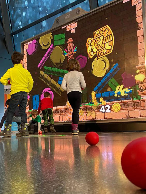 MultiBall 1 Young kids playing Idol Crush game on MultiBall exergaming multi-sports gaming wall at corporate event hire