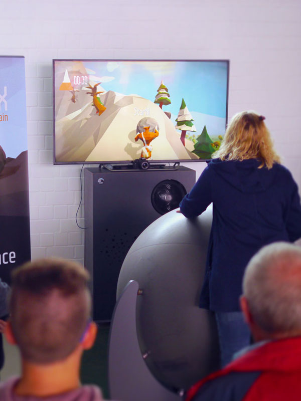 Home 5 Adult female plays the exergame SisyFox aka FoxBall Physical Gaming for Interactive Sports and Leisure
