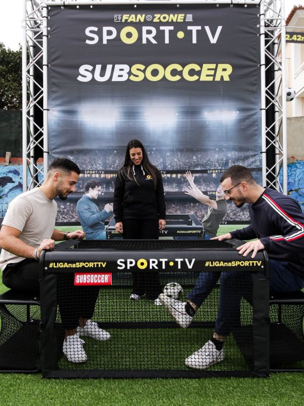 Subsoccer® 1 Football fan zone with 2 males playing Subsoccer® table football game for interactive sports and leisure
