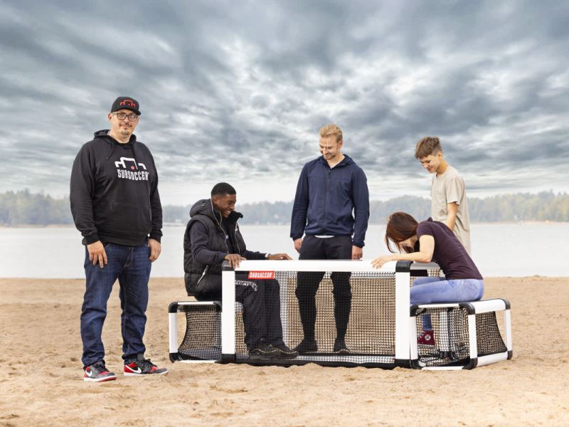 Subsoccer® 8 Male and female have fun on the beach with Jarno and Subsoccer® table football game for interactive sports and leisure