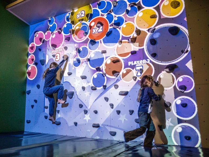 ValoClimb 2 Young girls have fun on Valo Motion ValoClimb immersive climbing wall with Hullaballoon for interactive sports and leisure