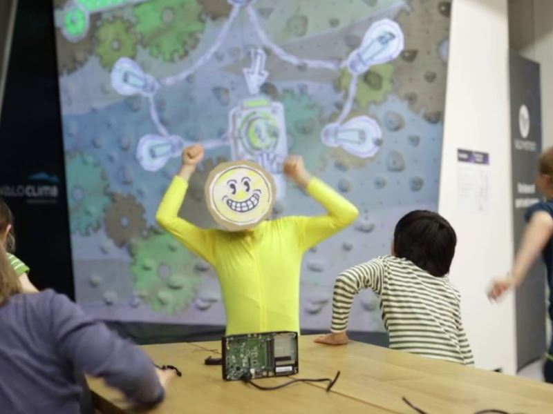 ValoClimb 8 Game character has fun with Valo Motion ValoClimb interactive climbing wall featuring Short Circuit game