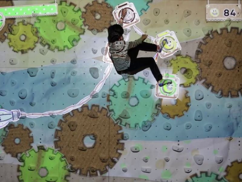 ValoClimb 6 Young kid has fun on Valo Motion ValoClimb immersive climbing wall with Short Circuit for interactive sports and leisure