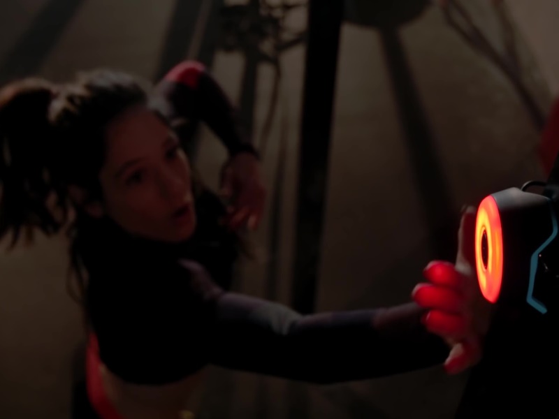 BlazePod 3 Athletic female jumps and touches BlazePod Flash Reflex Training Device.