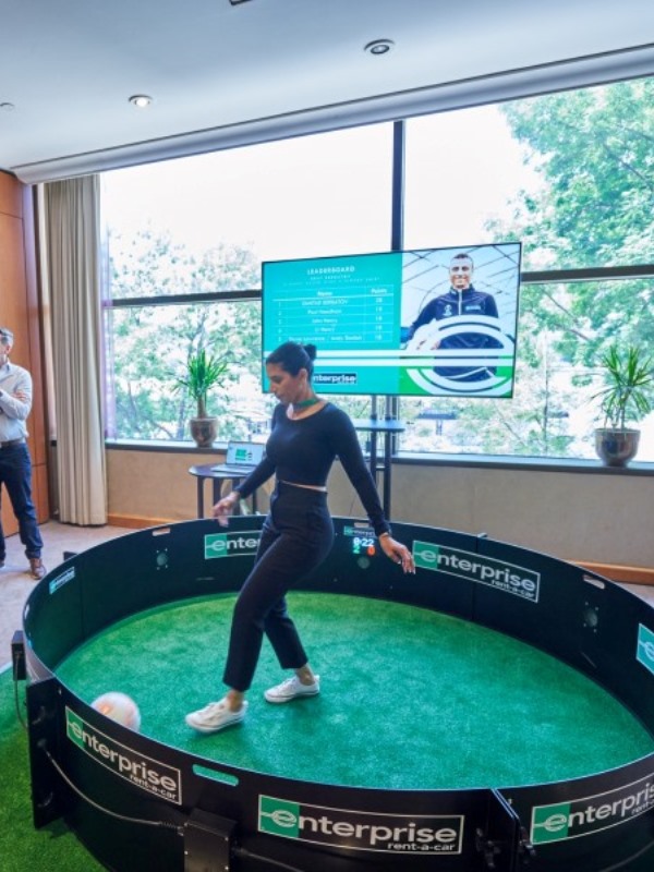 Home 4 Young female plays exergame ICON Fast Feet football skills arena for interactive sports and leisure