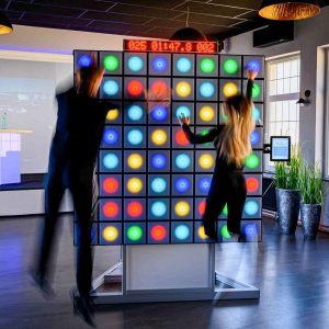 Event Hire 10 Young male and female compete with twall® A Series interactive reaction wall with LED lights