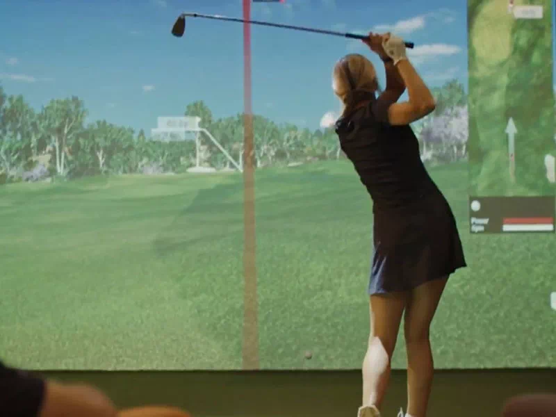 golfin idra golf sim launch monitor rentals young female player