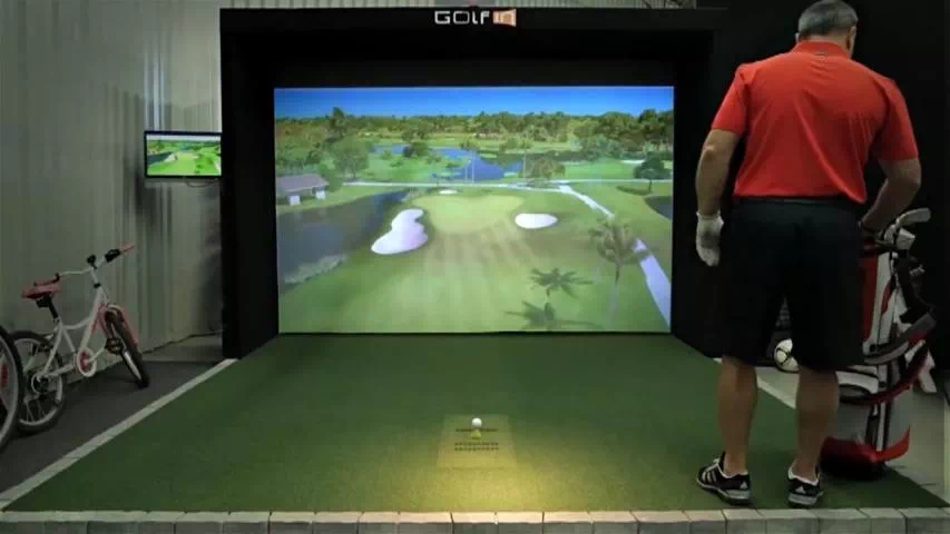 golfin idra golf simulator launch monitor hire older male playing golf