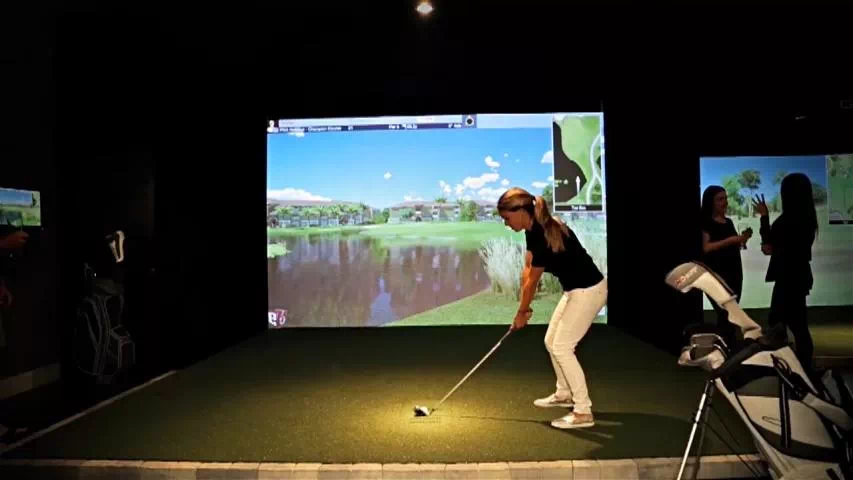 golfin idra golf simulator launch monitor rentals young female golfer