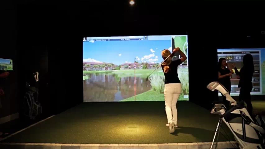 golfin idra golf simulator launch monitor rentals young female golfer